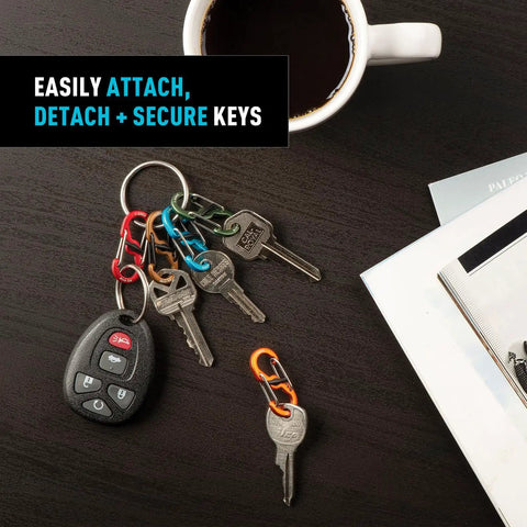 Colorful S Biner Keyring Set With Five MicroLock Carabiners For Quick Key Organization And Easy Key Swaps On A Lightweight Aluminum Locker Keychain For Grab And Go Everyday Carry And Quick Access displayed on a table with keys and a coffee cup.