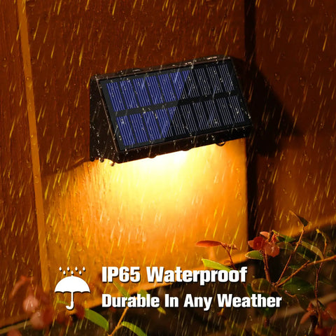 Solar Fence Post Lights 6 Pack, Waterproof Outdoor LED Fence Lighting in rainfall displaying IP65 waterproof durability.
