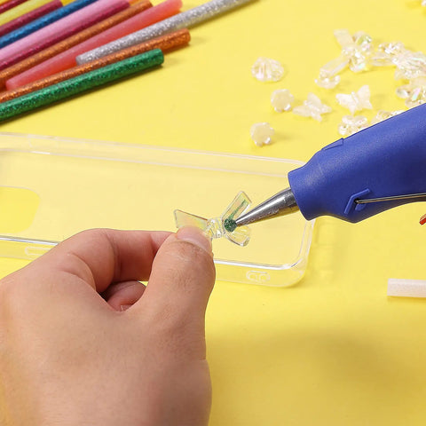 Using Glitter Hot Glue Sticks 4 By 0.27 Inch Mini Colored 48 Pack For Hot Glue Gun on a clear phone case with decorative elements.