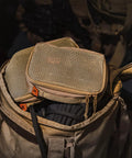 Durable Travel Packing Cubes Set With Zippers Luggage Organizers For Backpacking Waterproof 500D Nylon Build Tactical Style Packing Cubes To Keep Your Gear Tidy On The Go Essential Travel Organizer Kit in khaki inside a backpack