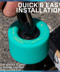 Teal Fireball skateboard wheel being installed with built-in spacers and a bearing press tool.