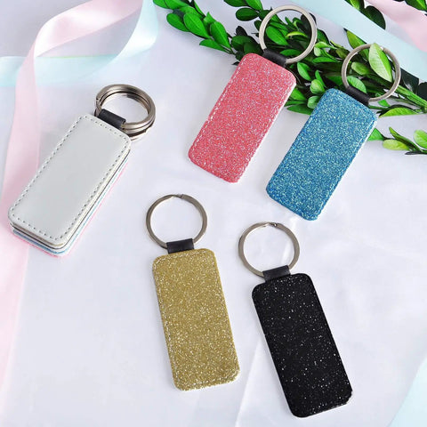 Dope 8 Pack Sublimation Blanks Keychains Glitter Rectangle Set in gold, blue, black, pink PU leather with stainless steel rings.