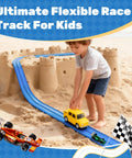 Child playing with 16 Ft Flexible Roll Up Race Car Track Set With Suction Cups on sand, compatible with 1:64 diecast cars.