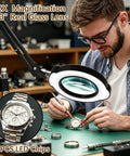 Man using 12X Magnifying Glass With Light And Clamp for watch repair; hands-free lamp with 84 LED real glass lens in workshop.