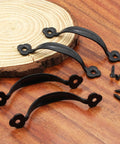 12 Pack Black Barn Door Handles Zinc Alloy Gate Pulls for cabinets or drawers with mounting screws included on a wooden surface.