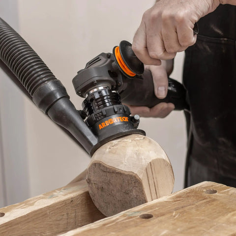 Heavy Duty Power Carving Tool Attachment Featuring A Slick Two Inch Cutting Disc And Adjustable Sanding System in use on timber.