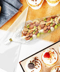 Cone Shaped Treat Bags For Popcorn And Snacks Pack Of 500 Clear Heat Resistant Pouches with nuts and desserts on table