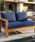 Outdoor Loveseat Cushion Set for Patio Comfort Cozy Up Your Outdoor Space 46 by 26 Inch Deep Seat Cushions Waterproof and Fade Resistant Navy Blue for Wicker Bench Swing and Couch Outdoor Furniture on wooden loveseat