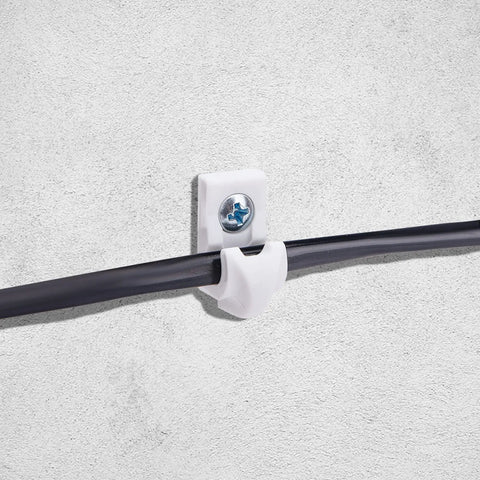 White Wire Shelf Brackets With Mounting Hardware Heavy Duty Closet Clips Built Tough For Pantry And Garage Storage installed on a wall.