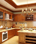 Luxury wooden kitchen with chandelier, marble counters, and decorative cabinets.