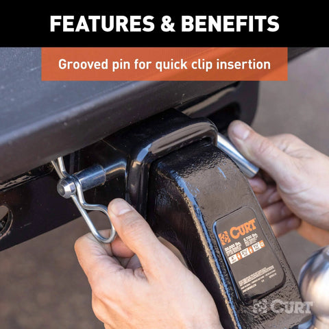 Beefy Heavy Duty Trailer Hitch Pin and Clip with Grooved Head, Five Eighths Inch Diameter, being installed in hitch receiver