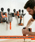 Heavy Duty Magnetic J Hooks Set With Anti Slip Layer For Metal Cabinets Garage Shelves And Garden Tools Beefy Build For Hanging Large Items Like Buckets Hoses And Tools Black Three Piece Set shown holding tools on pegboard