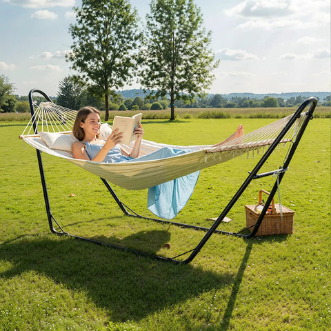 Woman reading on Beefy Heavy Duty Hammock Stand With Adjustable Frame For Outdoors Portable Double Bar Design Fits Most Hammocks 550 LB Capacity Black Iron Frame For Patio Garden Yard