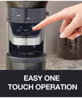 Hella Precise Automatic Coffee Grinder With Built In Scale And Thirty Nine Custom Settings For Bang Perfect Home Brews Solid Daily Ritual With Fourteen Oz Bean Hopper Sleek Black Design showing easy one touch operation with a finger on the button.