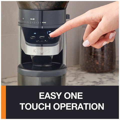 Hella Precise Automatic Coffee Grinder With Built In Scale And Thirty Nine Custom Settings For Bang Perfect Home Brews Solid Daily Ritual With Fourteen Oz Bean Hopper Sleek Black Design showing easy one touch operation with a finger on the button.