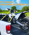 Heavy Duty Badass Ratchet Straps 4 Pack 2 Inch Wide By 27 Feet Long With Double J Hooks securing a motorcycle in a pickup truck.