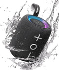 StormBox Mini Plus Portable Bluetooth Speaker with 360 Surround Sound, 12W Output, IPX7 Waterproof, RGB Lights, splashing in water.