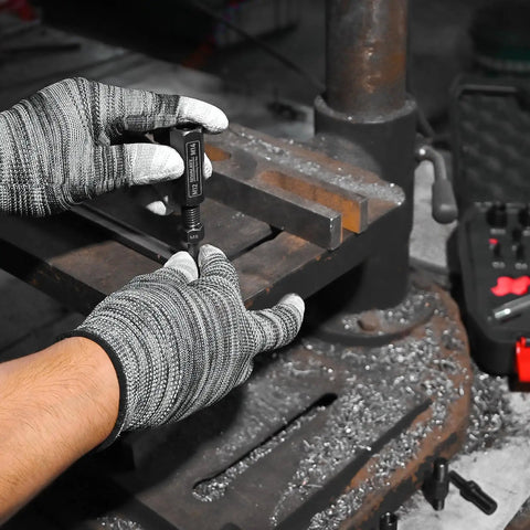 Close-up of hands using 24-Piece Slide Hammer Kit for Auto Repair and Dismantling with universal threaded adapters in workshop.
