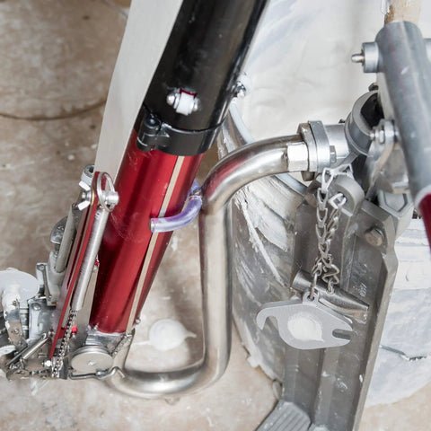 Pro Grade Compound Pump Gooseneck For Drywall Mud Loader, Heavy Duty Stainless Steel attached to a drywall bucket
