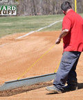 Person pulling Heavy Duty 3x5 Foot Drag Mat For ATV UTV And Lawn Tractor Leveling Field Surface on baseball field