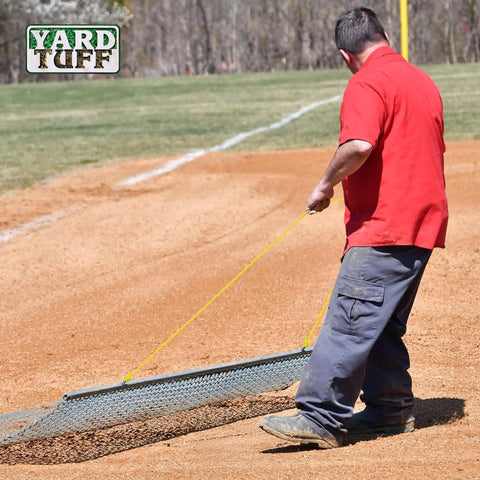 Person pulling Heavy Duty 3x5 Foot Drag Mat For ATV UTV And Lawn Tractor Leveling Field Surface on baseball field