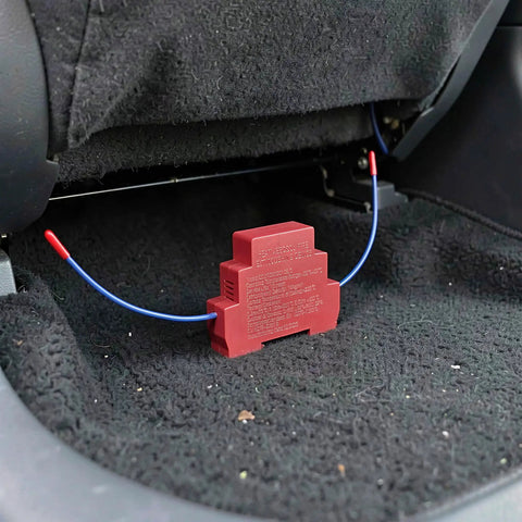 No Hassle Automatic Aerosol Fire Extinguisher 2 Pack dual nozzle unit installed in car interior for emergency fire protection.