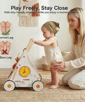 Totally Awesome Wooden Baby Walker And Activity Center With A Pretty Sweet 10 In 1 Sensory Play Console and Built In Tunes For Kickstarting First Steps. Child holding the walker with her mother nearby.