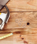 40 Pack Copper Sealing Washers 0.4 Inch Flat Gaskets For Hydraulic Systems And Oil Drain Plugs on a wooden surface