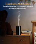 Waterless Essential Oil Diffuser Starter Kit With Four 10mL Hotel Scent Fragrance Oils Battery Operated Portable Diffuser AN8 Kit Black on a bedside table