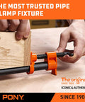 Two Pack Fifty Two Inch Wood Gluing Pipe Clamp Fixture For One Half Inch Black Pipe For Woodworking Projects With Long Reach Heavy Duty Clamp Set For DIY Furniture Making And Hands Free Setup For Pro Grade Results showing clamping action on wood board