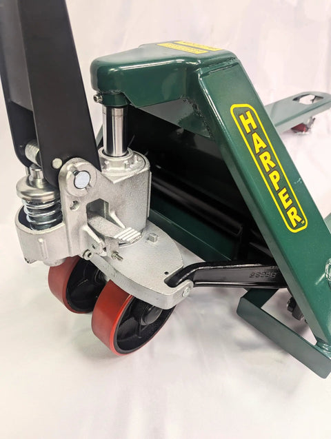 Close-up of Heavy Duty Manual Hydraulic Pallet Jack with reinforced steel frame and polyurethane wheels for smooth movement.