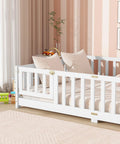 Full Size Floor Bed With Fence And Door For Toddlers And Kids, Safe Guardrails, Wooden Platform Bed in a cozy nursery room