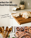 Wood cutting board with sliced bread, wooden utensils, and carvings to use with Food Grade Mineral Oil For Wood Cutting Boards, Countertops, And Butcher Blocks, Odorless And Tasteless Lubricant That Prevents Drying And Cracking, Safe On Marble And Soapstone, Keeps Surfaces Smooth And Ready To Use.