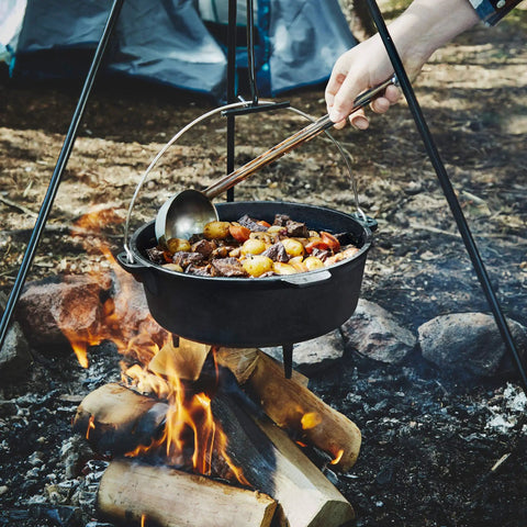 Six Quart Cast Iron Camping Dutch Oven With Lid Lifter And Storage Bag For Campfire Cooking Stews And Baking over fire