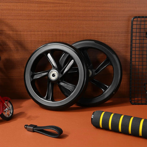 Two Pack 175mm PU Scooter Wheels Replacement Set For Mobility And Stunt Riding Non Slip Wear Resistant Weatherproof Easy Install Maintenance Free Smooth Roll For Kick Scooters And Skateboards in black, leaning against wall.