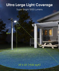 Ridiculously Bright Solar Dusk To Dawn Flood Light With 1000 Lumens installed near a house illuminating a large outdoor area.