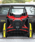E Track Tie Down Rail Kit 31 Piece Set with a rugged UTV secured in a truck bed using yellow ratchet straps.