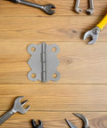 24 Piece Vintage Butterfly Hinges With Replacement Screws For DIY Furniture Projects Sturdy Iron Hardware on wooden surface