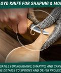Score This Premium Wood Spoon Carving Knives Set featuring razor sharp sloyd blade in use on a wooden spoon.