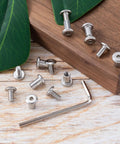 Top Shelf Stainless Steel Hex Socket Cap Bolts With Barrel Nuts And Hex Wrench M4 X 8MM Binding Post Screws Rust Resistant Hardware Kit on wood.