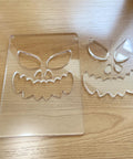 Kickass Acrylic Router Template For Jack O Lantern Faces With 8 Durable Halloween Pumpkin Patterns 5.5X8 Inch solid polymer mask set on wood.