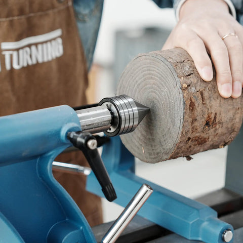 Heavy Duty MT2 Live Tailstock Center For Wood Lathe With 60 Degree Ball Bearing Tip Bad Boy Woodworking Accessory in use on log.