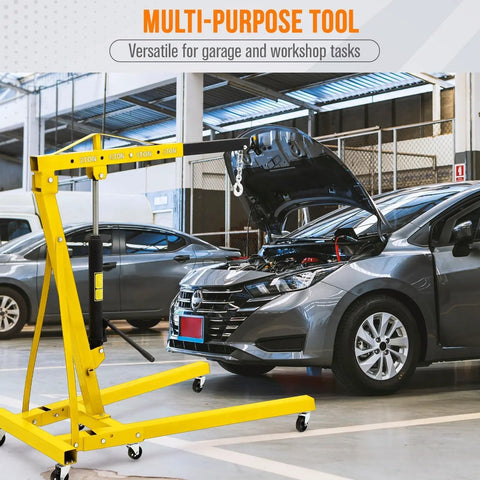 Heavy Duty Foldable Engine Hoist 2 Ton 4400 Pounds Steel Hydraulic Shop Crane with Telescopic Boom in garage.