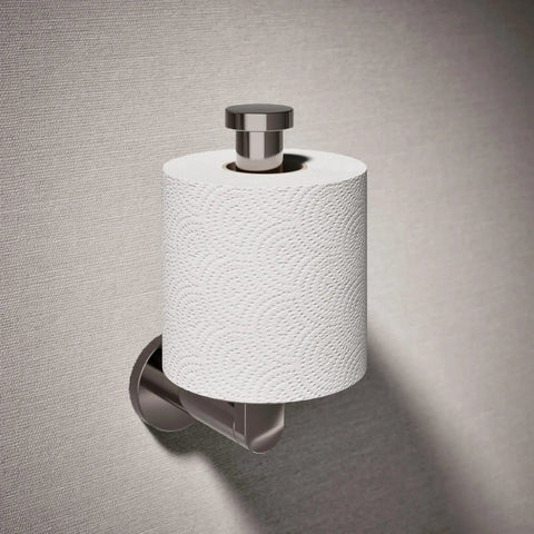 K-73148-TT Composed Vertical Toilet Tissue Holder In Titanium Finish, mounted on wall with toilet paper roll