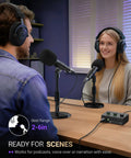 Two people using Dual USB And XLR Dynamic Desk Mic For Podcasts With Mute Button And Adjustable Stand Windscreen.