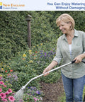 Woman using 30 Inch Soft Rain Watering Wand With Gentle Shower Spray in garden, highlighting comfort grip and lightweight design.
