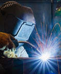 Welder using Game Changing Smooth Rolling ER70S6 Mig Welding Wire 0.045 Inch Diameter Two Pound Spool for clean arcs.