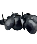 Fifty Pack Rugged Iron Clavos Decorative Nails One Inch Round Head Antique Furniture Tacks on a surface, black steel with a hammered finish.