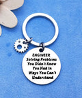 Engineer Solving Problems You Didnt Know You Had Keychain with pendant, gear charm on blue background.