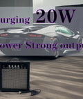 20W Electric Guitar Practice Amp With EQ Controls, Portable Orange Black Finish, Gain Bass Treble And Volume Knobs, placed on asphalt.